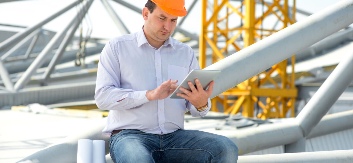 A Foreman With Digital Tablet At The Construction Supervising Th
